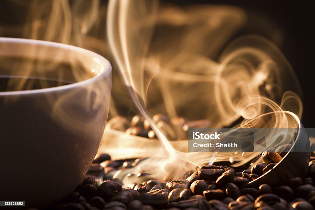 Strange golden smoke taking away from coffee seeds Coffee - Drink Stock Photo