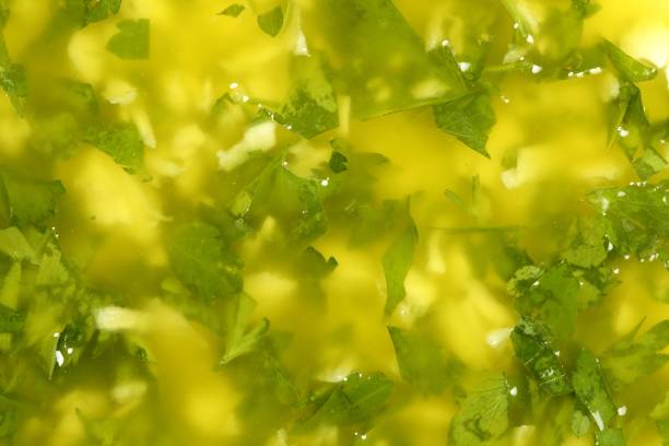 garlic lemon and parsley sauce garlic lemon and parsley sauce mediterranean food texture garlic bulb stock pictures, royalty-free photos & images