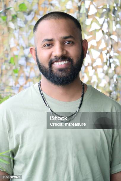Closeup Image Of Indian Man With Buzz Cut Hairstyle To Disguise Receding  Hairline Wearing Tshirt With Necklace Posing Looking At Camera Stock Photo  - Download Image Now - iStock