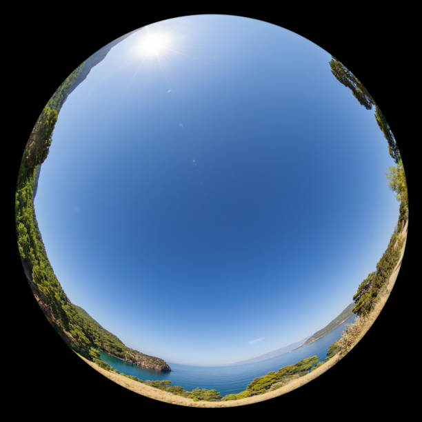 Round Fisheye Photo Of Sunny Mediterranean Sea Coastline Spheric fisheye view of Mediterranean Sea coastline. Sun is in view with lens flare. No people are seen in frame. Shot with a full frame DSLR camera and a fisheye lens. fish eye effect stock pictures, royalty-free photos & images