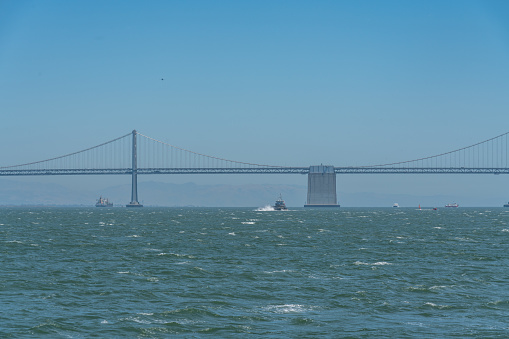 Nautical vessels in the San Francisco Bay under the Bay Bridge