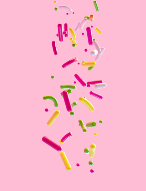 streusel, die in 3d-illustration von oben fallen, isoliert auf rosa hintergrund - cupcake cake candy pink stock-fotos und bilder