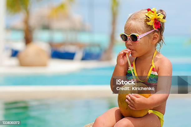 Portrait Of Cute Toddler Girl With Coconut Cocktail Stock Photo - Download Image Now