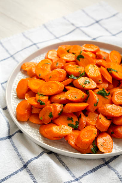 istock Homemade Sauteed Carrots on a plate, low angle view. 1338304079