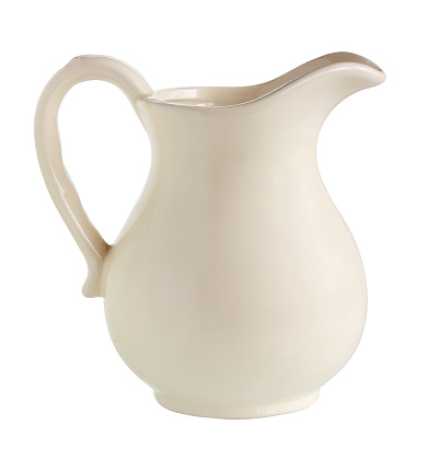 white jug isolated on a white background with a cut-off path one ceramic jug without a pattern