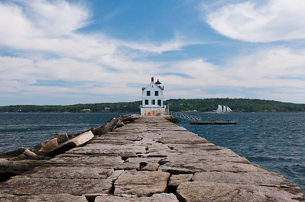 Rockland Breakwater Lighthouse A view of the Rockland Breakwater Lighthouse seen from the breakwater on Jameson Point in Rockland, Maine. groyne stock pictures, royalty-free photos & images