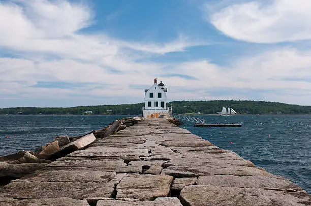 A view of the Rockland Breakwater Lighthouse seen from the breakwater on Jameson Point in Rockland, Maine.