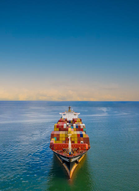 Aerial view of container freight ship carrying container box for import and export business logistic.
