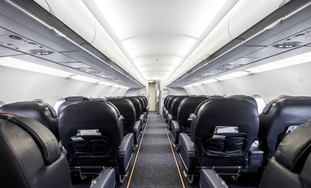 istock Interior of the passenger airplane with leather seats. 1338307980