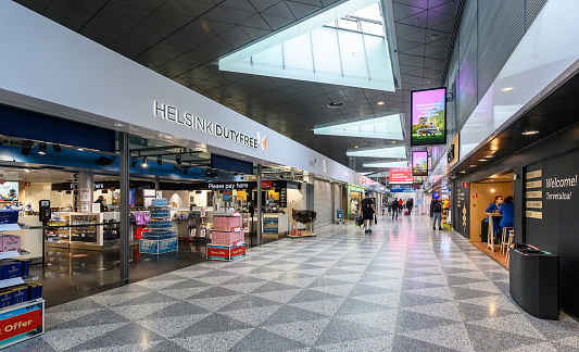 Helsinki, Finland 12.08.2021: Airport Helsinki Vantaa restores normal operation after travel restrictions by Covid-19 pandemic control protocols. Transit zone with duty free shops