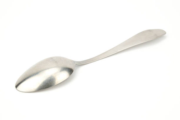 istock A tablespoon lying on the diagonal of the image, bottom up. 1338310350