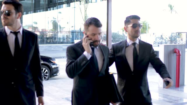 Bodyguards escorting a businessman