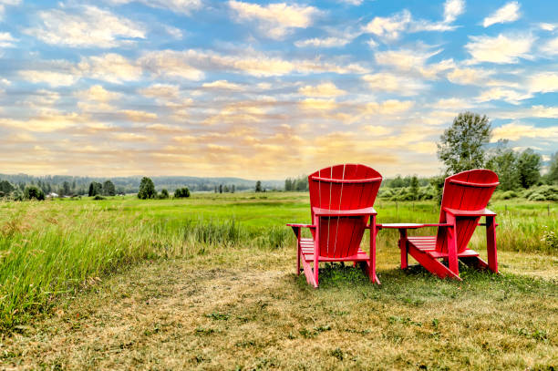 istock Adirondack chairs overlooking a prairie vista 1338314727