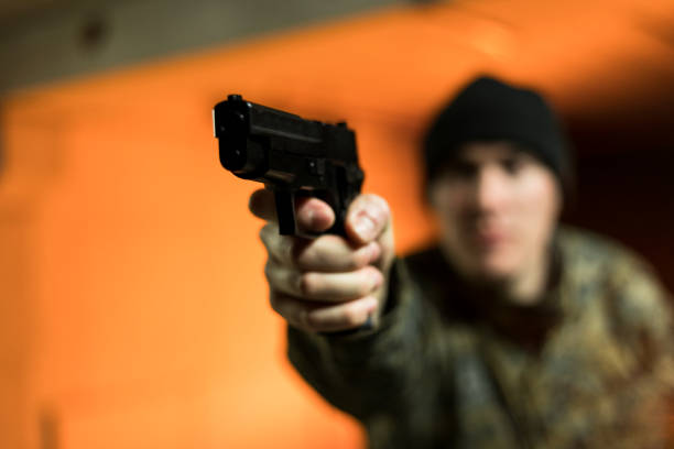 Soldier in action Soldier in action aiming his gun. head shoot stock pictures, royalty-free photos & images