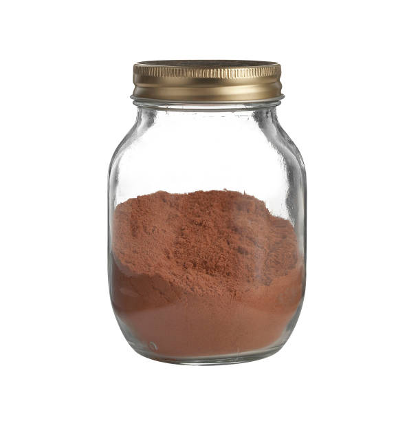 chocolate powder in glass jar isolated on white background