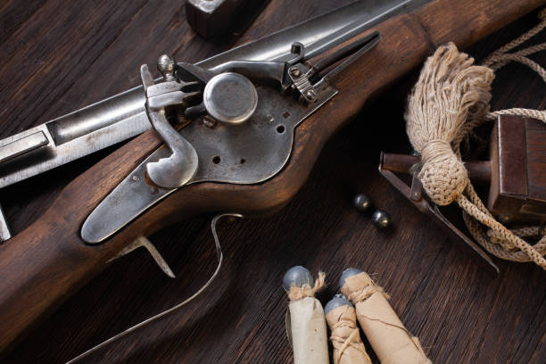istock 17th century ancient flintlock musket with powder flask and led bullets. 1338319182