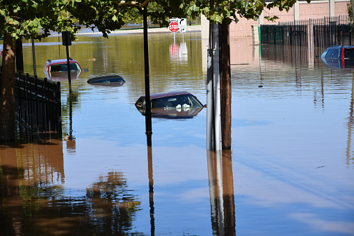 New Brunswick, NJ USA - September 2, 2021: City of New Brunswick flooded after Hurricane Ida. Submerged cars on the flooded roadways and highways of the City of New Brunswick, NJ after flooding from hurricane Ida.