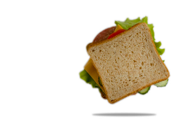 istock sandwich with cheese, tomato, sausage isolated on white background 1338324866