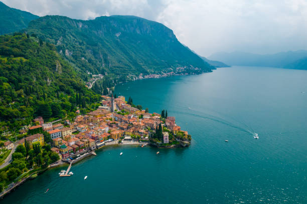 Aerial view of Varenna village on a coast of Como lake, Italy Aerial view of Varenna village. Varenna is a picturesque and traditional village, located on the eastern shore of Lake Como, Italy lake como photos stock pictures, royalty-free photos & images