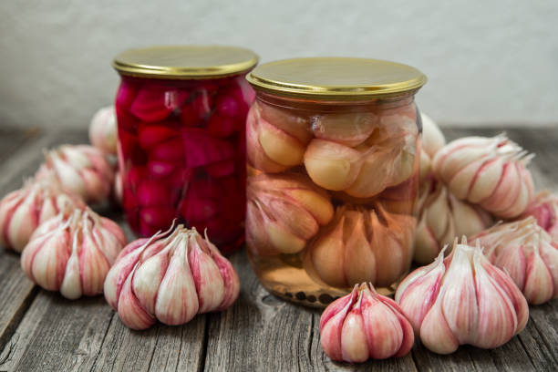 istock Pickled garlic in jars. Home canning, harvest. 1338329783
