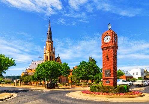 Landmark brick clock tower at intersection in rural regional town Mudgee of Australian outback.