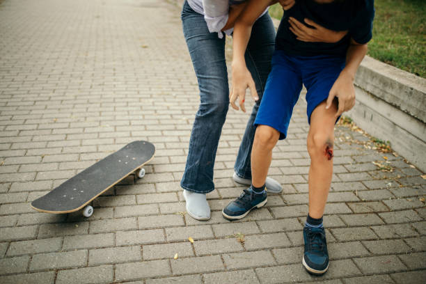 istock Injured boy after falling down from skateboard 1338332741