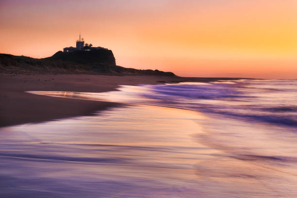 istock Newcastle Nobbys pink beach rise 1338332805
