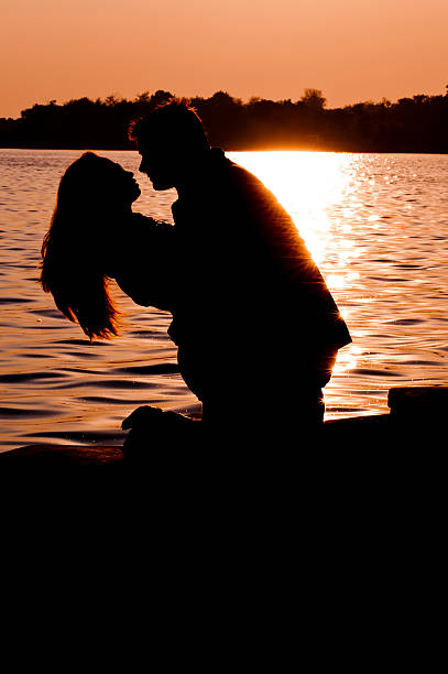 istock silhouette young couple in love 133833297