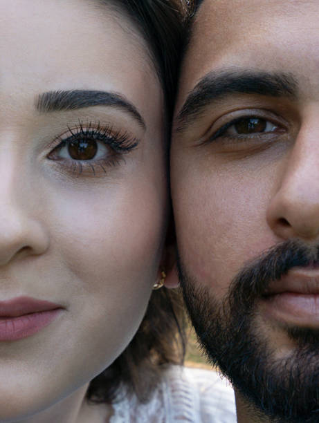 istock Young couple poses cheek to cheek completing a whole 1338339024