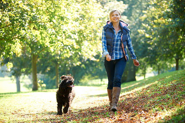 istock woman walking dog 133834215