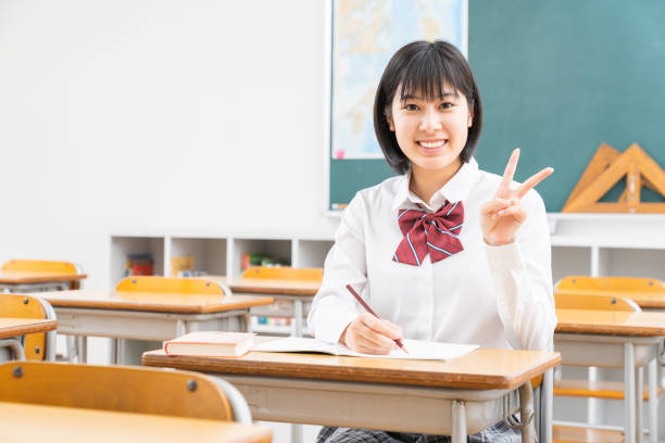 istock Asian schoolgirl studying in the classroom, uniform, 1338347602