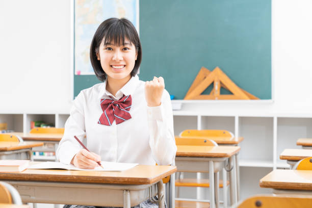 istock Asian schoolgirl studying in the classroom, uniform, 1338347610