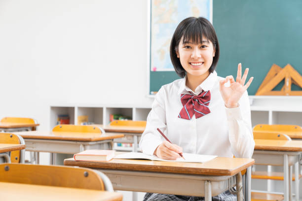 istock Asian schoolgirl studying in the classroom, uniform, 1338347644