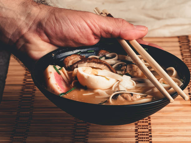 istock Ramen noodle soup with chicken breast, egg and spinach 1338347702
