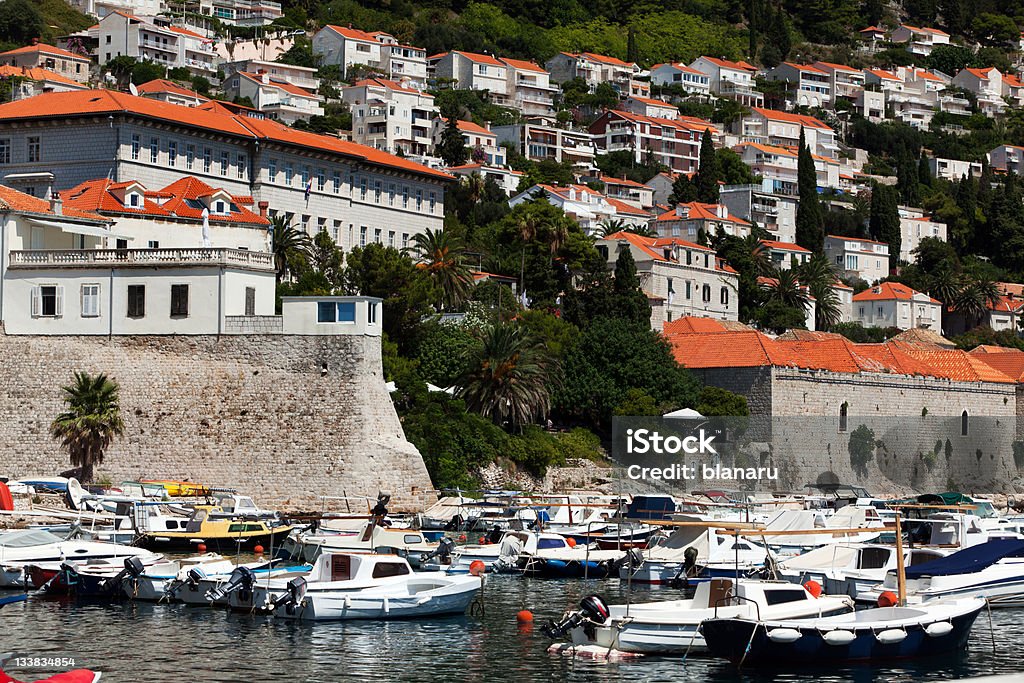 Dubrovnik Destinations Walled Dubrovnik Old town with harbor, Croatia. Adriatic Sea Stock Photo