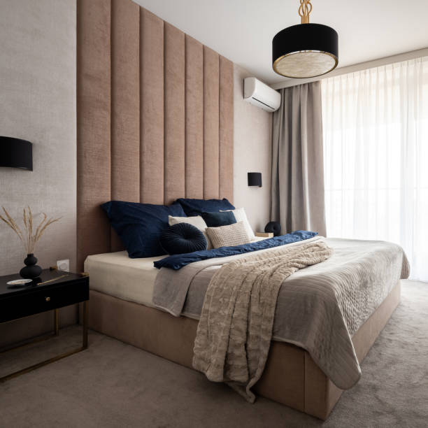 istock Elegant and classy bedroom with upholstered wall 1338350477