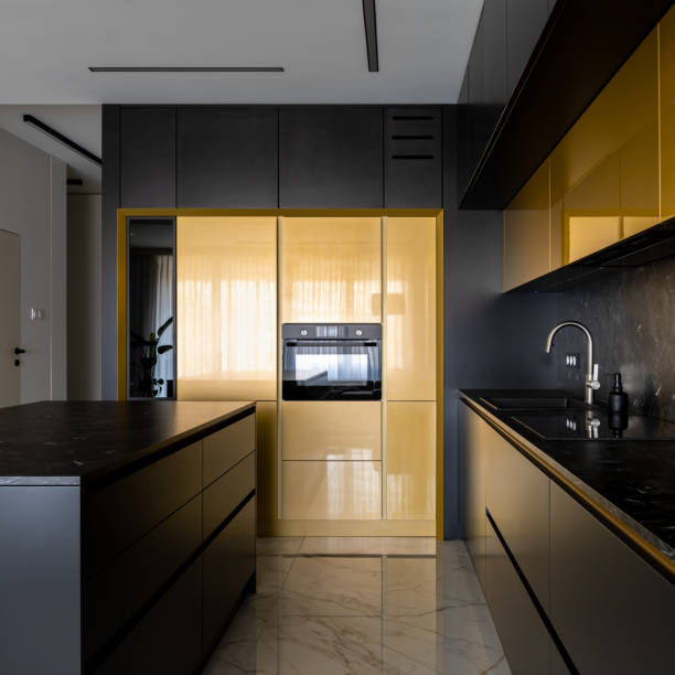 istock Elegant black and gold kitchen with kitchen island 1338350479