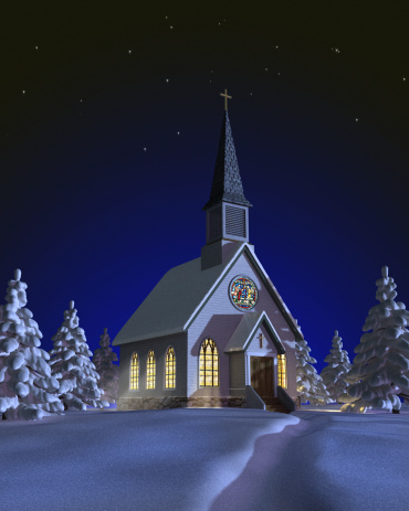 Church at night in a snowy landscape with illuminated windows