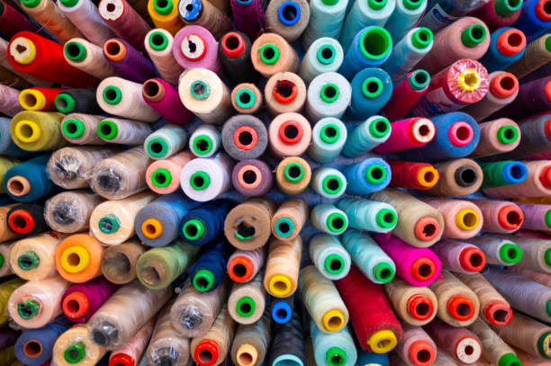 large group of variation colorful sewing thread in small business work place studio
