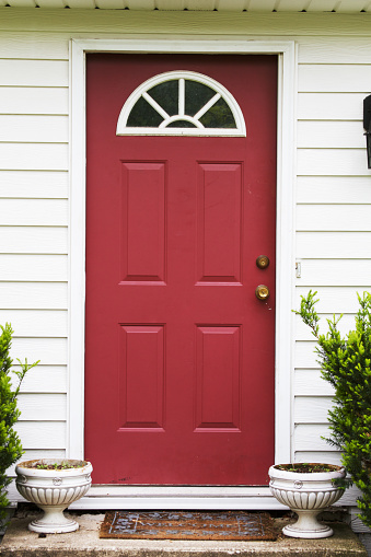 a red front door to a house. Note to inspector: this is the front door of my house.
