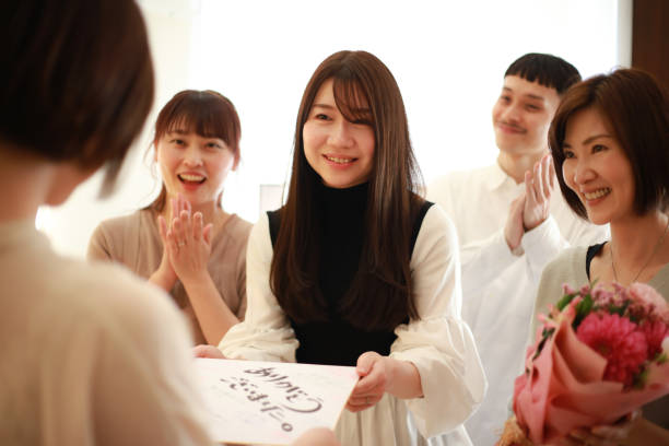 istock Women giving presents to transferees at work 1338362074
