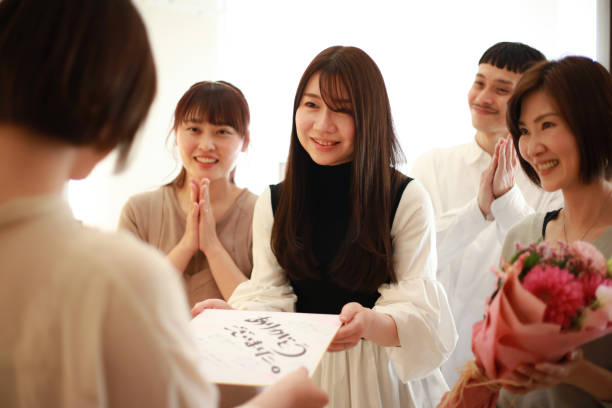 istock Women giving presents to transferees at work 1338362078