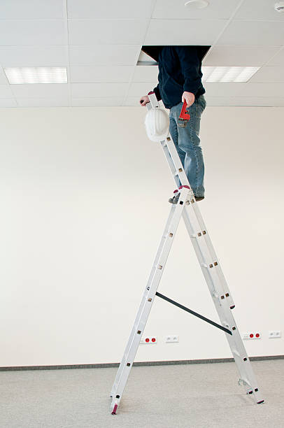 man on the ladder stock photo