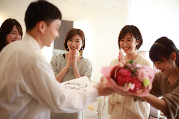 istock Women giving presents to transferees at work 1338363234