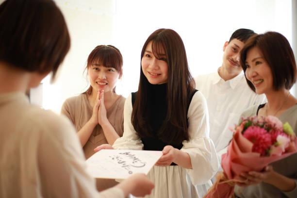 istock Women giving presents to transferees at work 1338363244