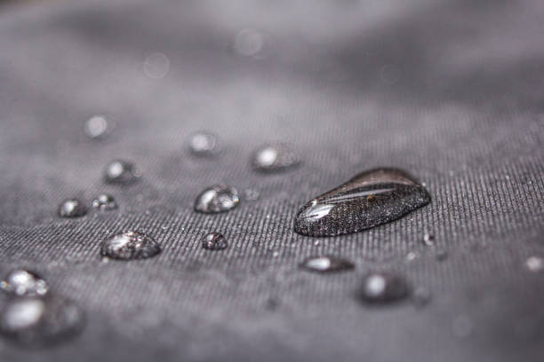 Water drops Small drops of water on canvas. Macro photography. water repellent stock pictures, royalty-free photos & images