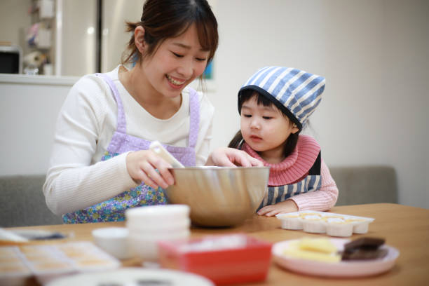 istock Parents and children making sweets 1338368820