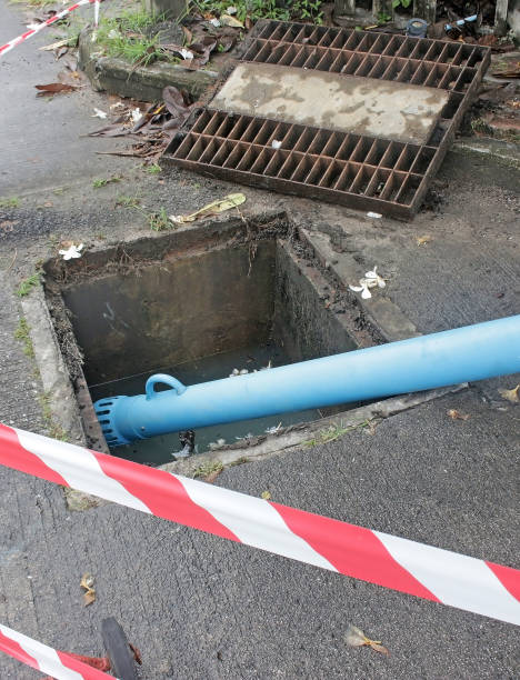 istock Manhole cover removed for pumping water 1338368915