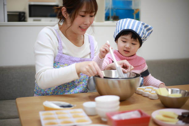 istock Parents and children making sweets 1338368943