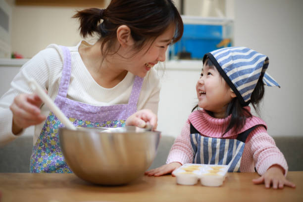 istock Parents and children making sweets 1338368951